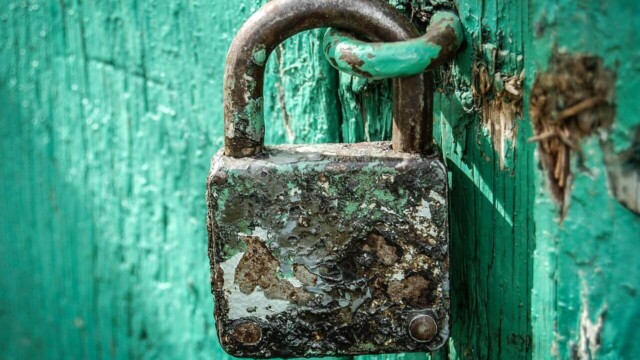 Rusty Padlock On Blue Door ALT